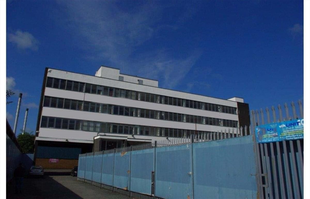 Exterior view of the white multi-story office building at 66 Long Lane.