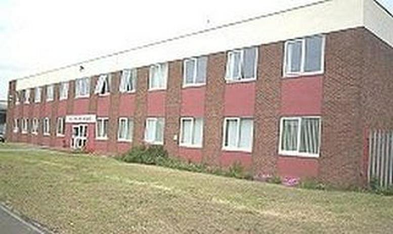 Exterior view of the brick facade and entrance at Richmond House, Avonmouth Way.