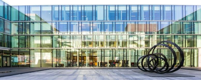 Exterior view of the glass-facade building at Robert-Bosch-Strasse 20.