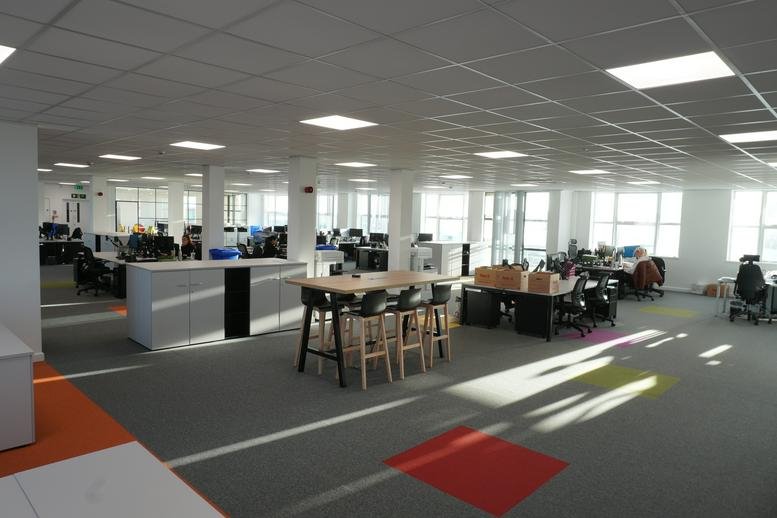 Spacious interior of the Royal Quays Business Centre featuring an open-plan workspace and natural lighting.