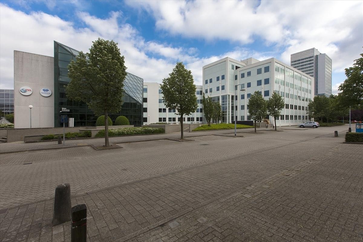 Exterior view of the modern glass and white panel building at Saturnusstraat 46-62.