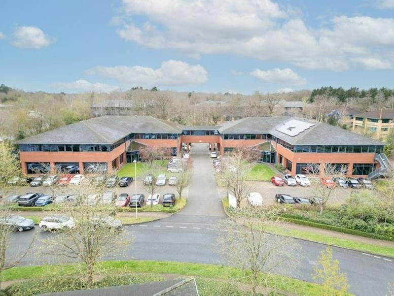 Wide exterior shot of the red brick facade of Sentinel House at Ancells Business Park.