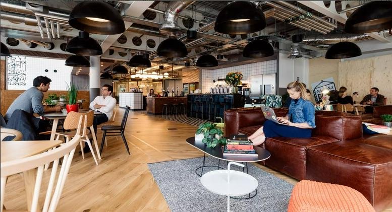 Spacious communal lounge at Shoreditch Mark Square, 1 Mark Square featuring leather sofas and industrial ceiling.