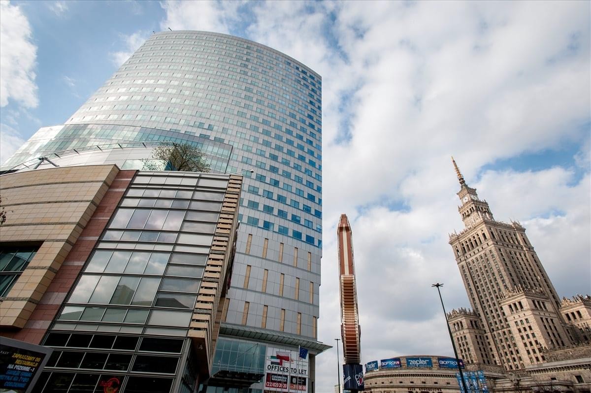 Exterior view of the modern glass-facade Skylight Building in the Zlote Tarasy complex.