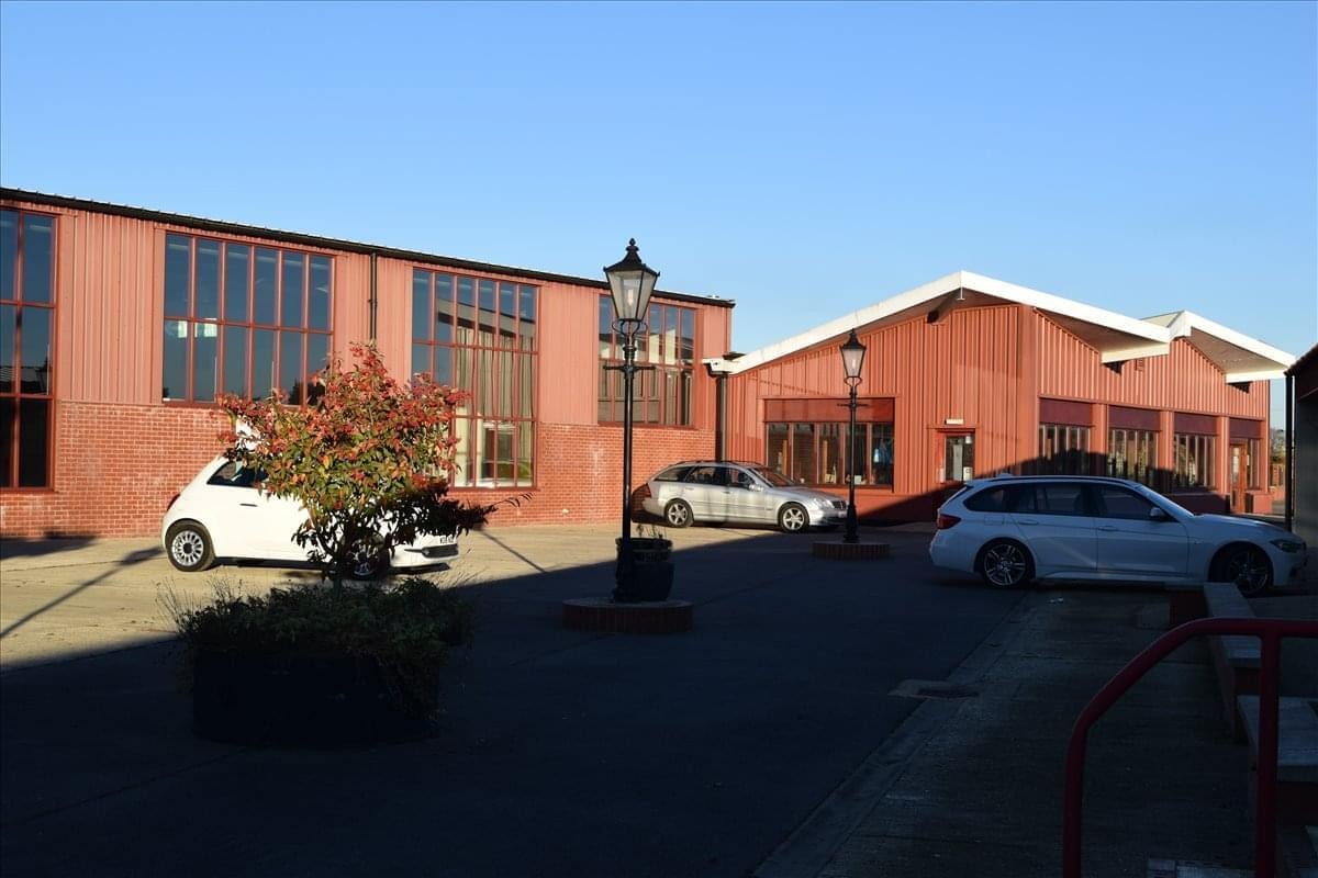 Exterior view of the red brick and glass facade at Snetterton Park, Snetterton, Norwich.
