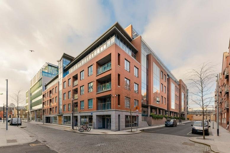 Modern red brick exterior of SOBO Works, Windmill Lane, Dublin, Ireland under a clear sky.