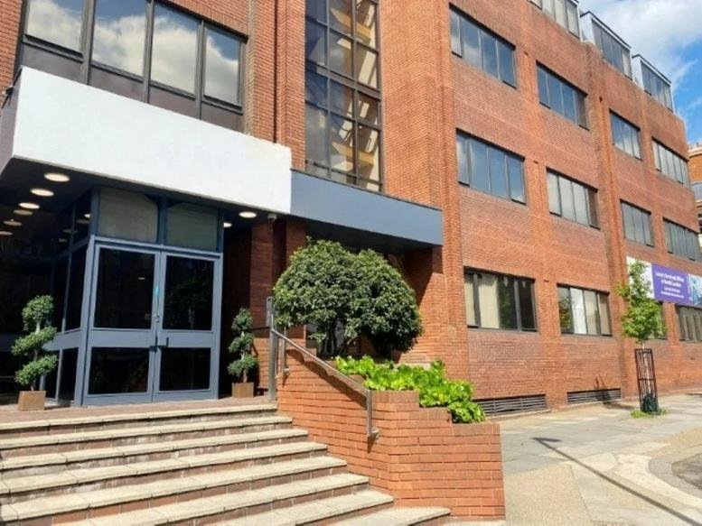 Exterior brick facade and main entrance of Solar House, 912 High Road.