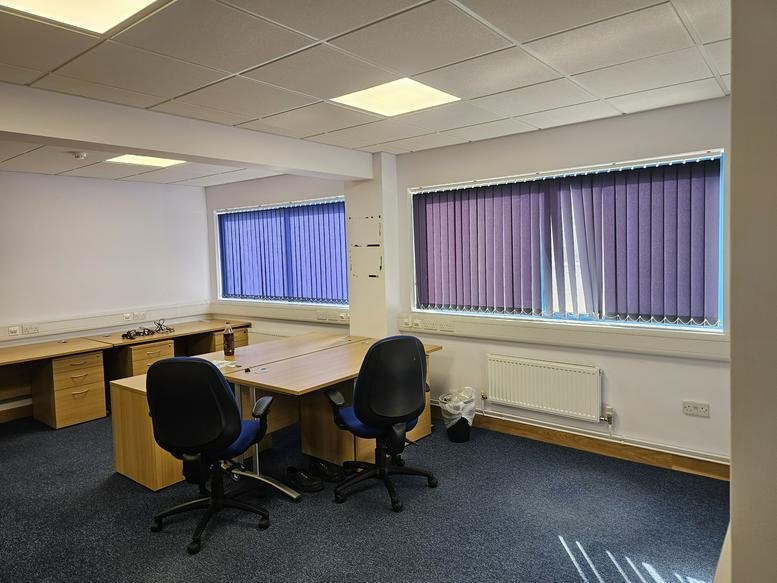 Spacious office workspace at Southam Drive, Industrial Area, Southam, Warwickshire with natural light and blue blinds.