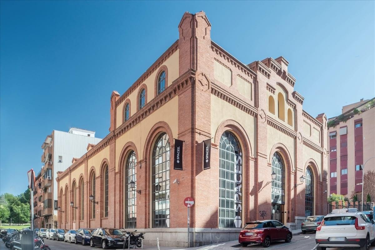 Exterior view of the historic brick and arched-window building at Spaces, Rio, Calle de Manzanares 4, Madrid.