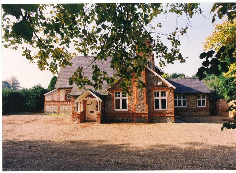 Exterior view of the historic brick and flint facade at St Martins House.