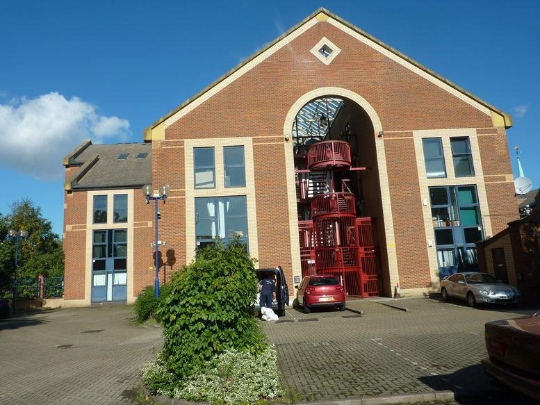 The brick facade and arched entrance of St Olav’s Court, 25 Lower Road.