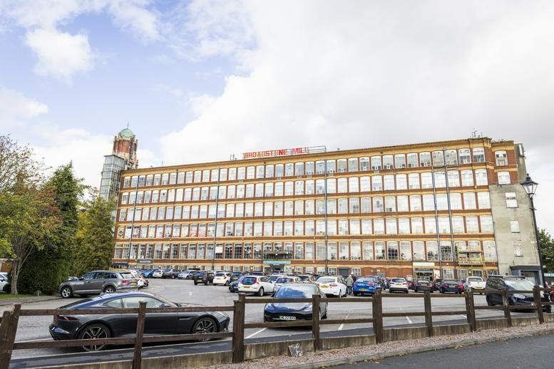 Exterior view of the historic red brick Broadstone Mill building at Stockport Business Incubation Centre.
