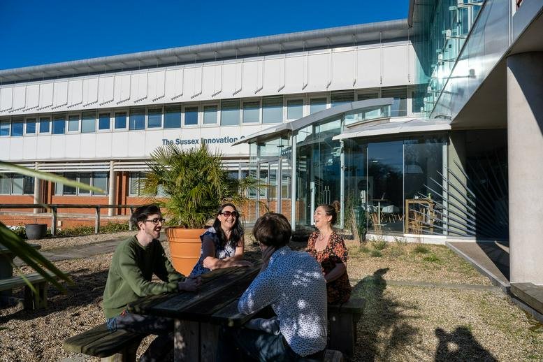 Exterior view of the Sussex Innovation Centre, Science Park Square, featuring a modern glass and steel facade.