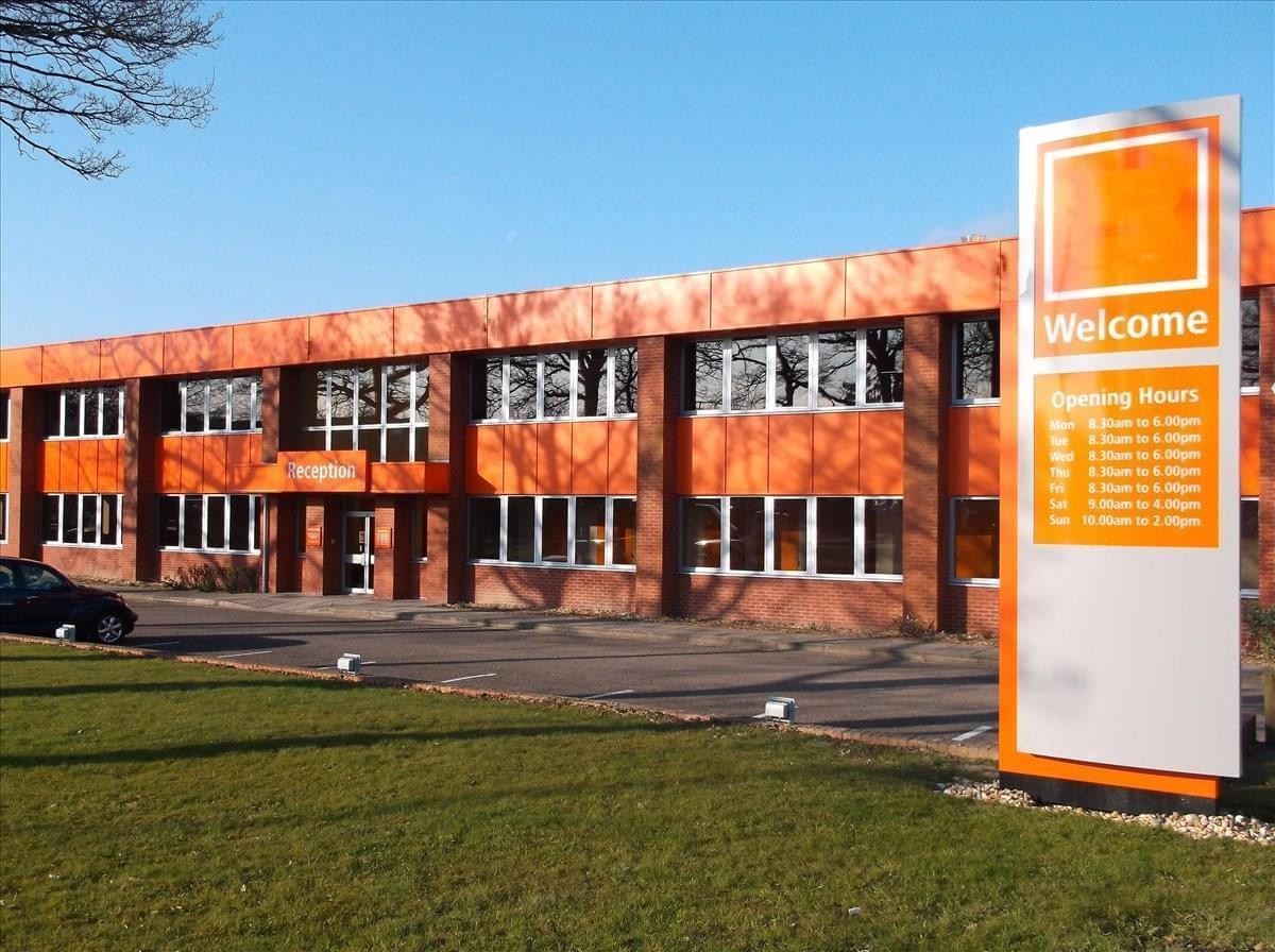 Exterior view of the orange-clad Sussex Manor Business Park, Gatwick Road.