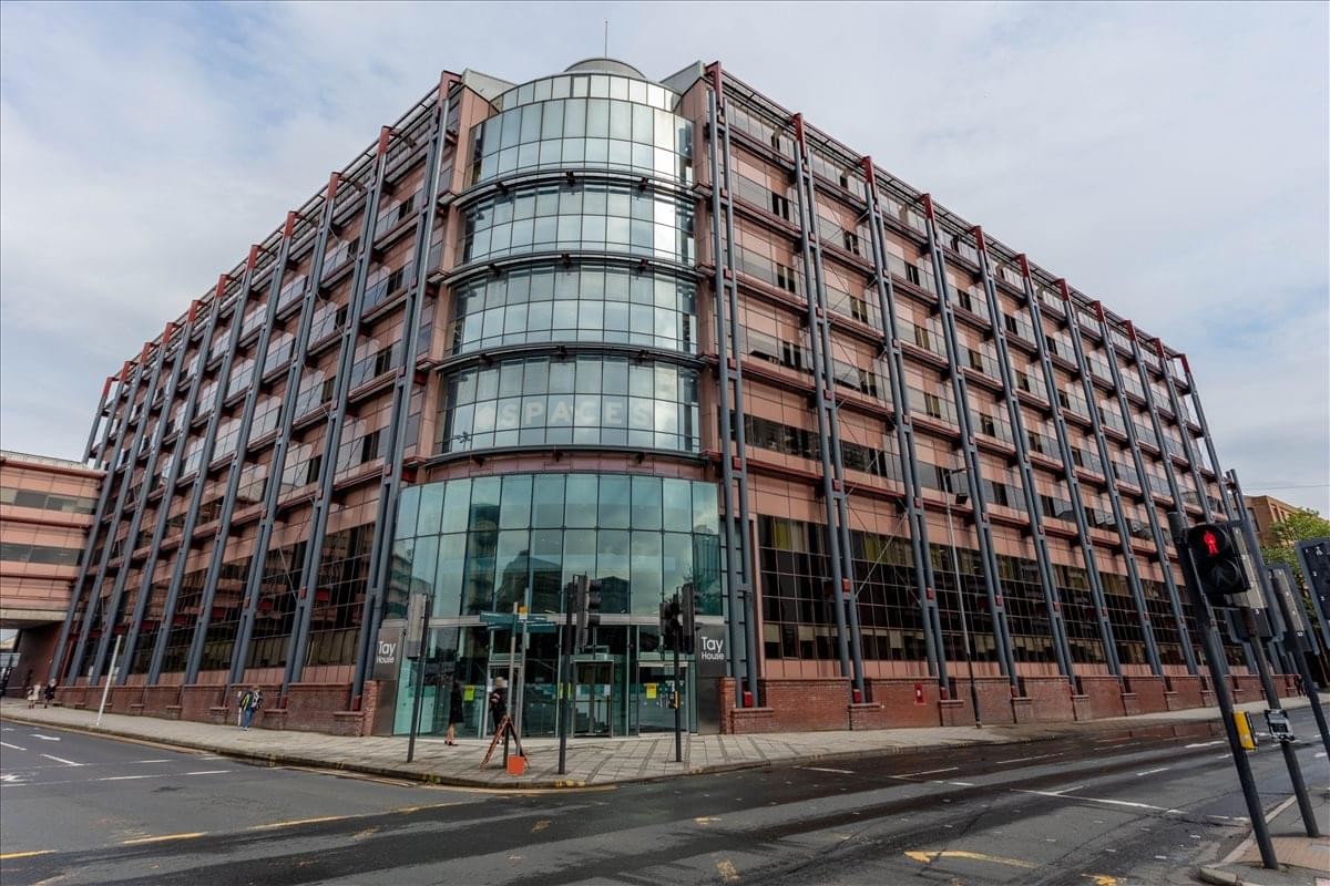 Modern exterior of Tay House, 300 Bath Street with a curved glass facade and red brick detailing.