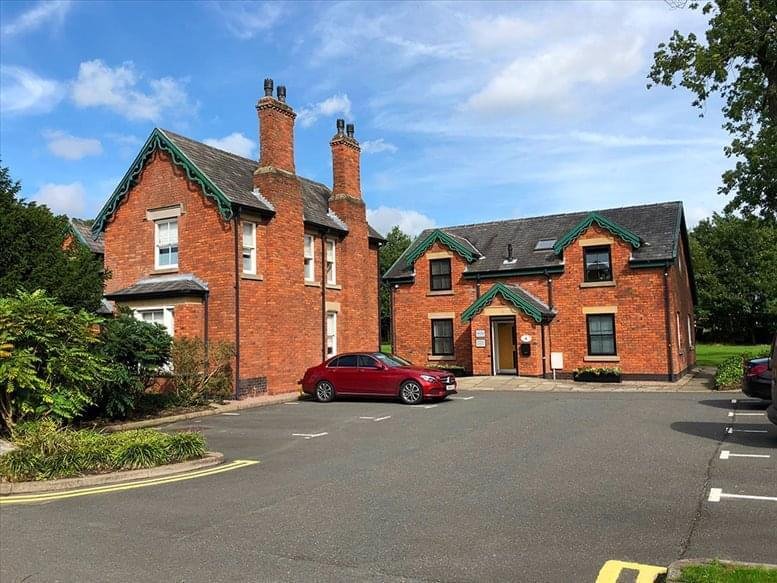 Exterior view of the red brick period buildings at Taylor Business Park, Warrington Road.