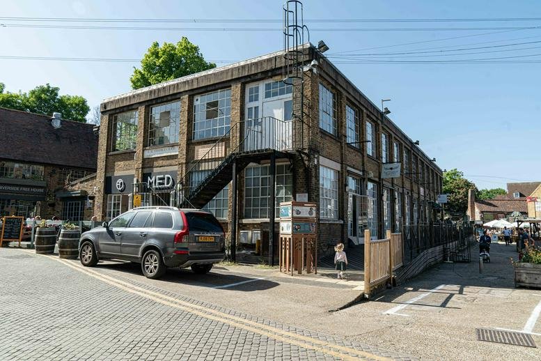 Exterior view of the brick industrial facade at The 1929 Shop, Unit 12.
