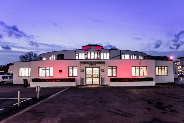 Evening view of the Art Deco exterior building of The Beehive, Beehive Ring Road, Gatwick, West Sussex.