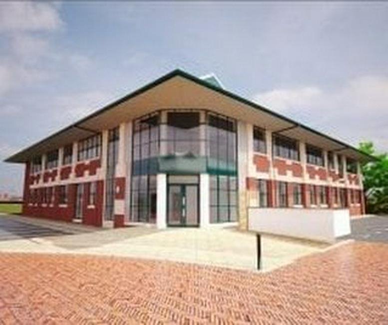 Exterior view of the brick and glass facade at The Breeze at Carnoustie House.