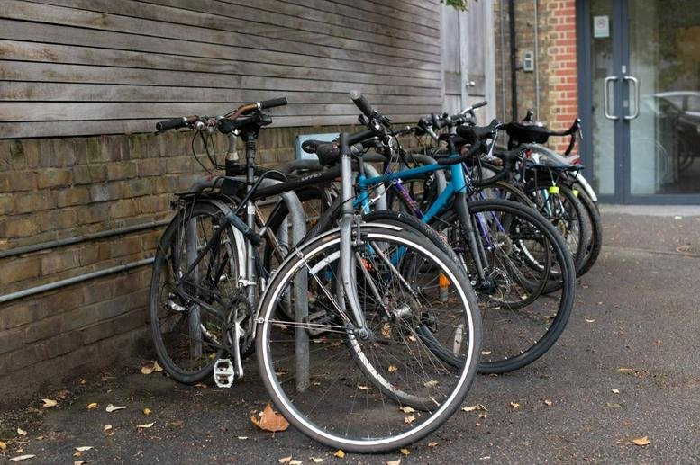 Bicycle storage area outside the wooden-clad facade of The Chandlery, 50 Westminster Bridge Road.