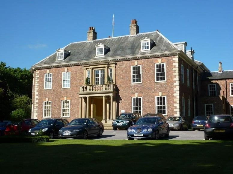 Exterior view of the historic brick facade of The Hall, Lairgate, Beverley, Yorkshire.