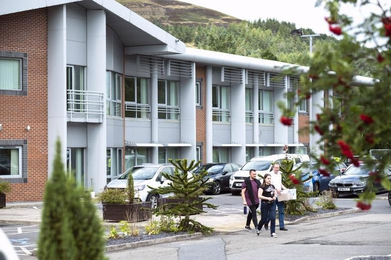 Exterior of the modern brick and glass building at The Innovation Centre, Victoria Business Park.