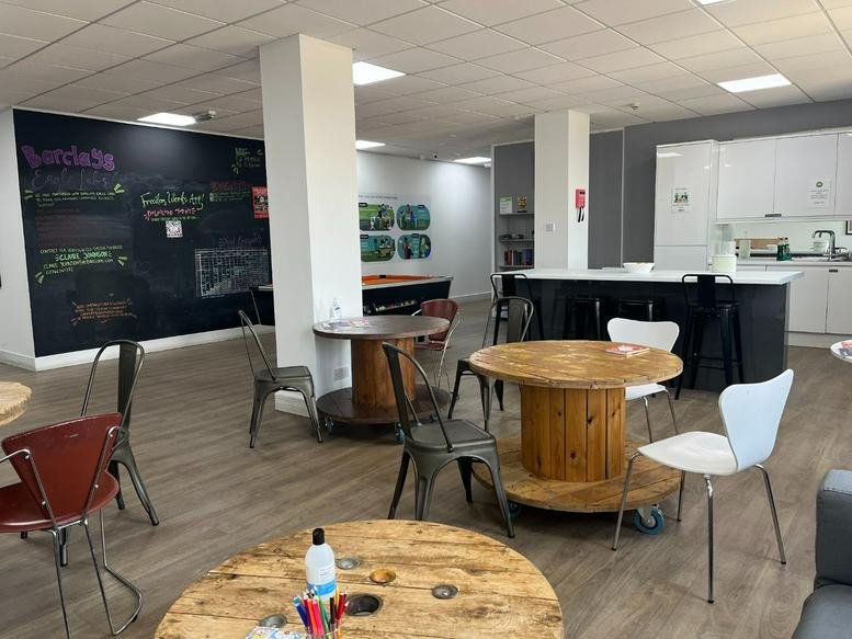 Spacious communal breakout area at The Mill Building, 31-35 Chatsworth Road with spool tables and kitchen.