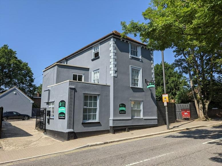 Exterior view of the grey facade at The Old Council Office, 37 Stanmore Hill.