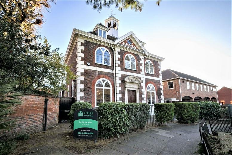 Exterior view of the historic brick facade at The Old Free School, George Street.