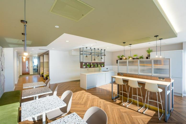 Spacious communal dining area and modern kitchen at The Plaza, 100 Old Hall Street, St Paul's Square, Liverpool.