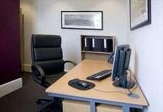 Private office at The store room, Ring Road, Leeds, Yorkshire with a large desk, leather chair, and monitor.