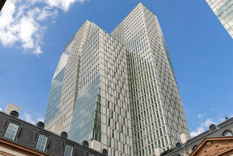 Exterior view of the striking glass and limestone facade at Thurn-und-Taxis-Platz 6.