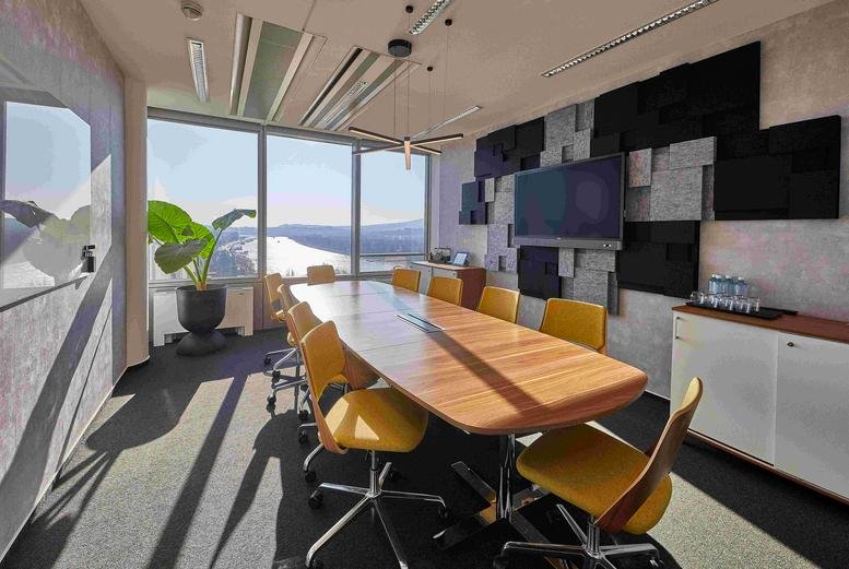 Spacious boardroom at Budapest - Népfürdő utca 22. with city views and yellow chairs.