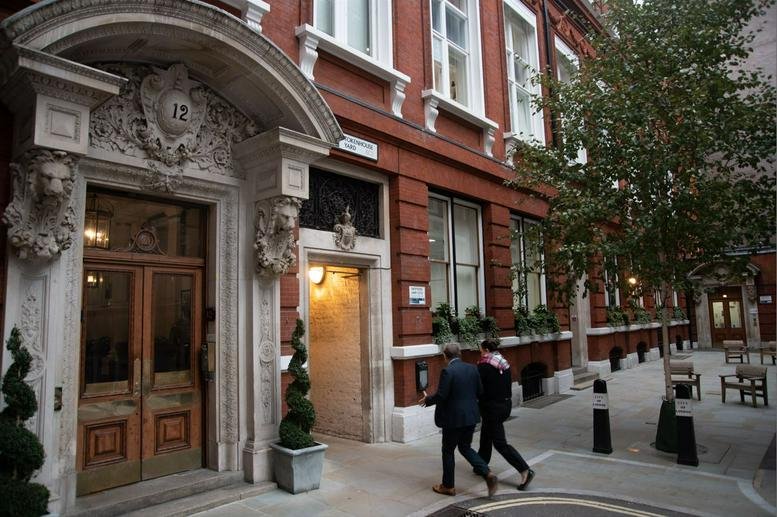 Classic red brick exterior facade and ornate stone arched entrance of Tokenhouse, 11-12 Tokenhouse Yard.