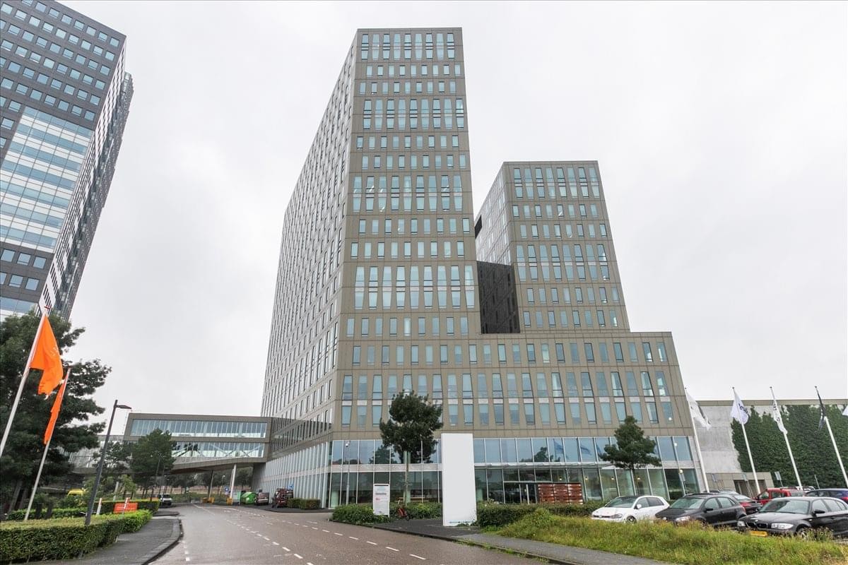 Exterior view of the multi-story Trade Centre building with its distinctive grey facade.
