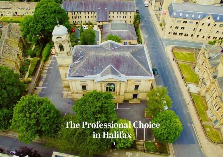 Aerial view of Trinity House, Harrison Road, Halifax, Yorkshire showing the historic architecture and green surroundings.