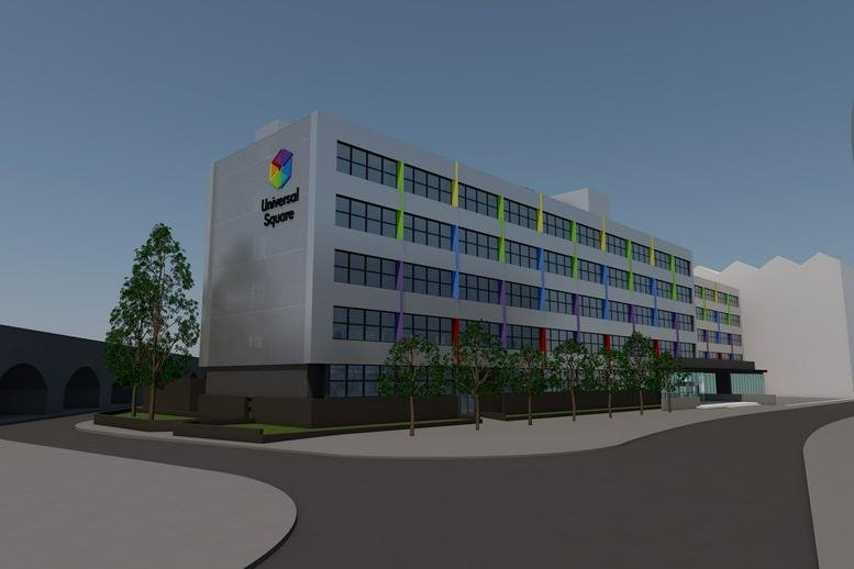 Exterior view of the multi-story Universal Square building with colorful facade accents and green trees.