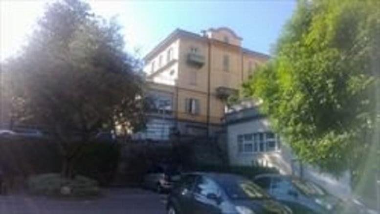 Exterior view of the classic multi-story building at Via Clemente Maraini 2, Lugano, Switzerland.