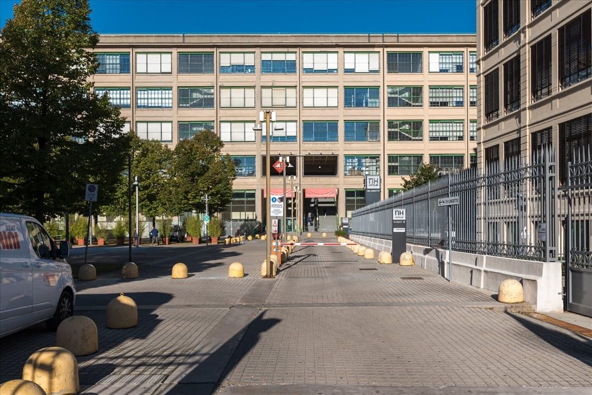 Exterior view of the historic industrial facade of Via Nizza 262, Lingotto.