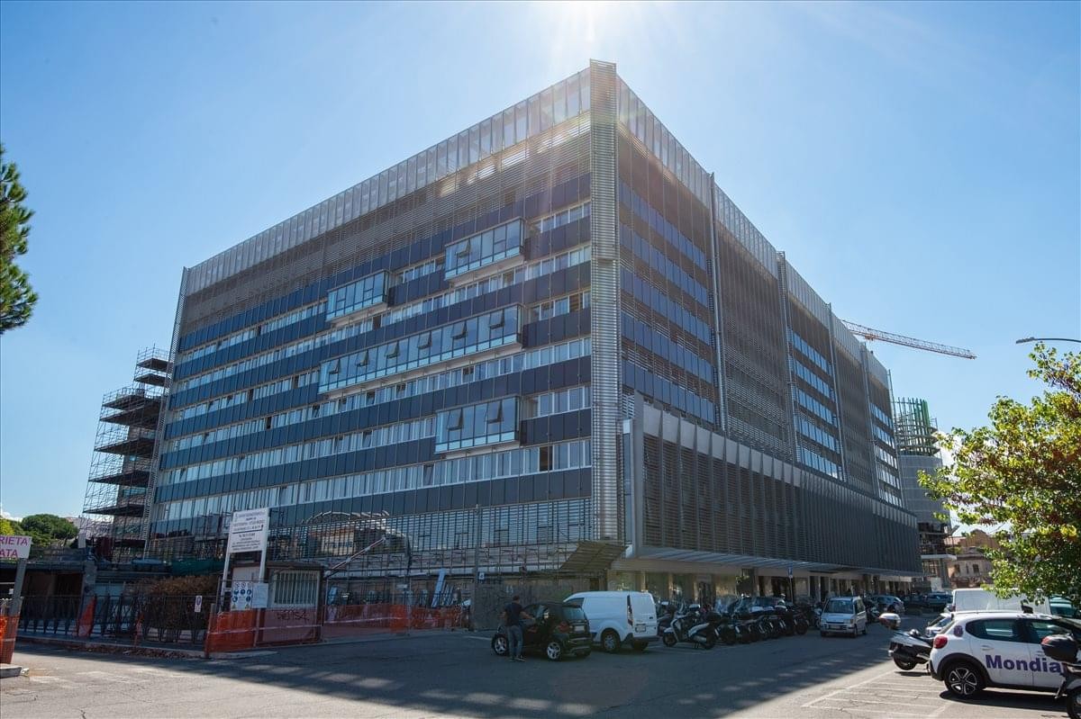 Exterior view of the multi-story industrial-style building at Via Ostiense 131/L, Rome.