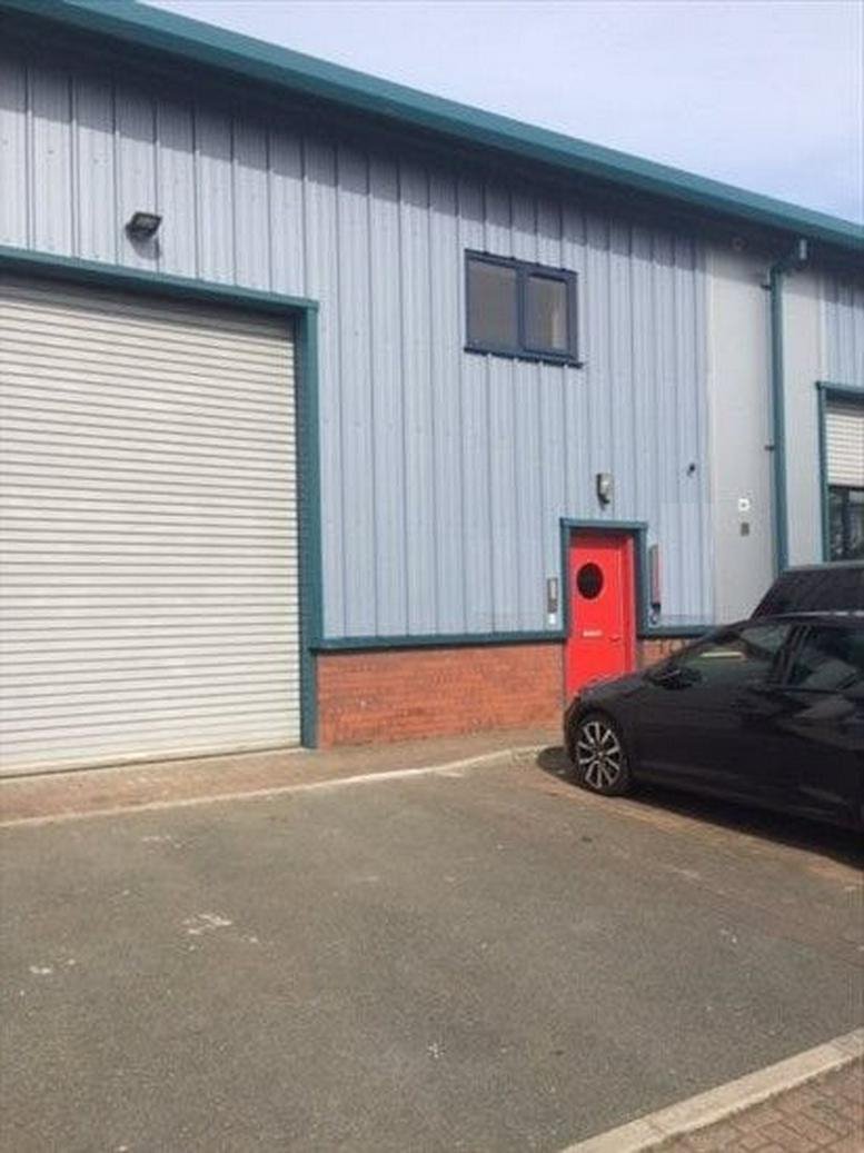 Exterior facade of Walker House, 2 Hardy Close showing the industrial style building and red door.