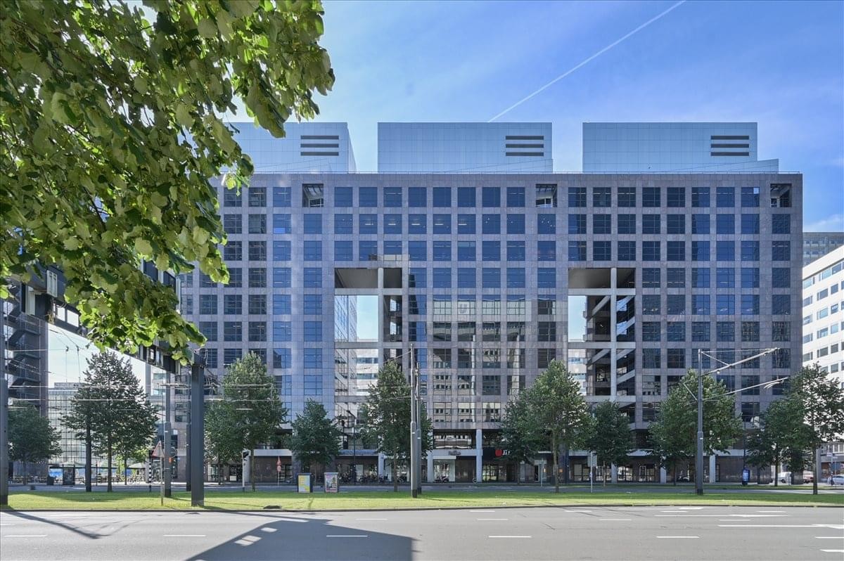 Exterior view of the glass-facade building at Weena 290.