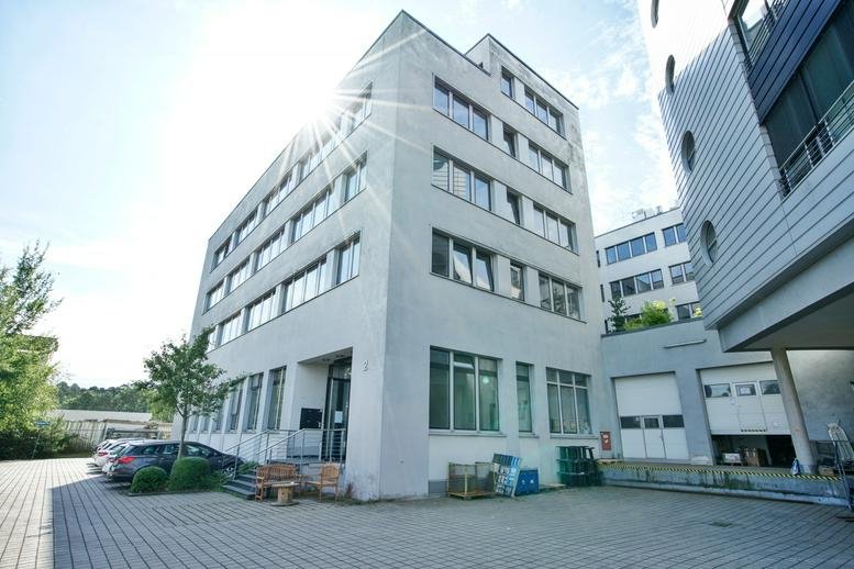 Exterior view of the modern five-story building at Werner-Heisenberg-Straße 2.
