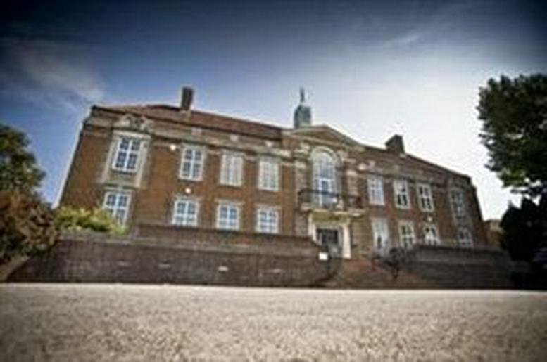 Exterior view of the historic red brick facade at Wesley House, Bull Hill.