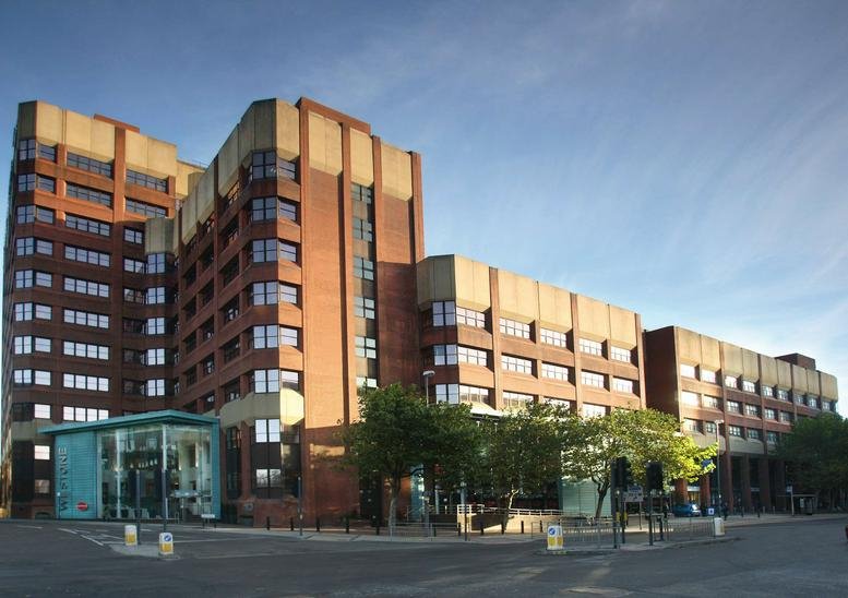 Exterior view of the red brick and stone West One, Wellington Street building.