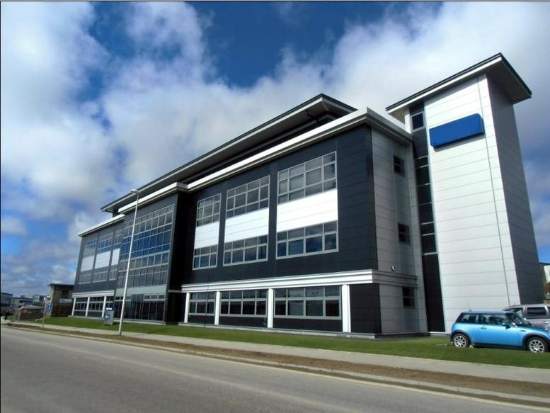 Exterior facade of the modern multi-story Westpoint House building under a blue sky.