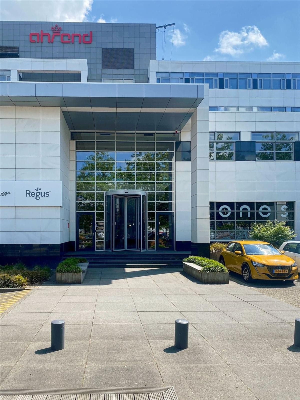 Exterior view of the modern glass and stone facade at White Point, Laarderhoogtweg 25.