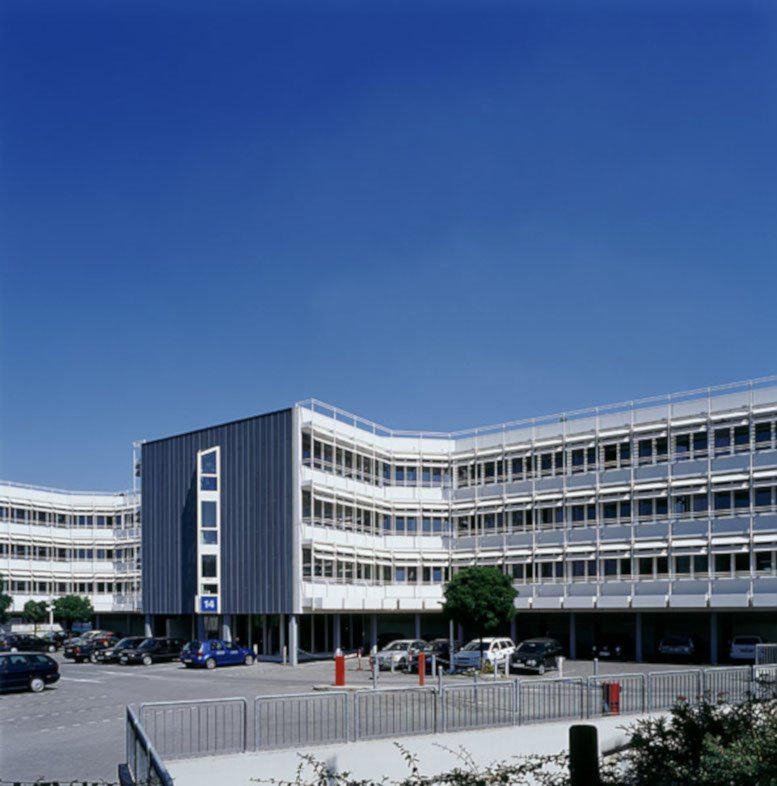 Exterior view of the multi-story modern glass and steel building at Wilhelm-Theod.-Roemheld-Str. 14.