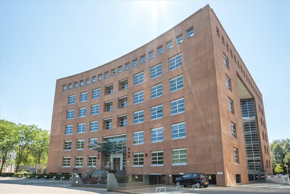 Exterior view of the brick facade at Zen Building, Newtonlaan 123.