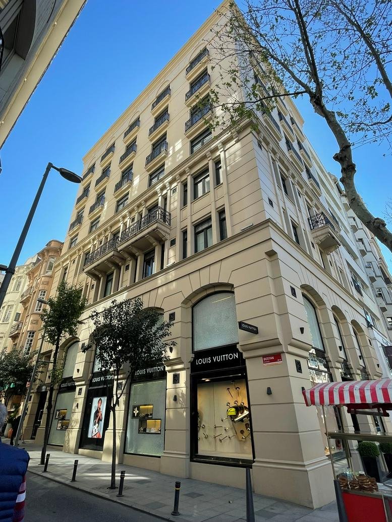 Exterior facade of the historic Orjin Is Hanı building on a sunny day.